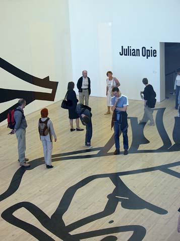 Visitors examine the artist's lines