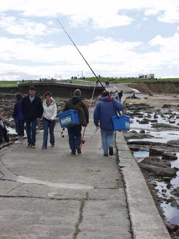 Fishers on causeway